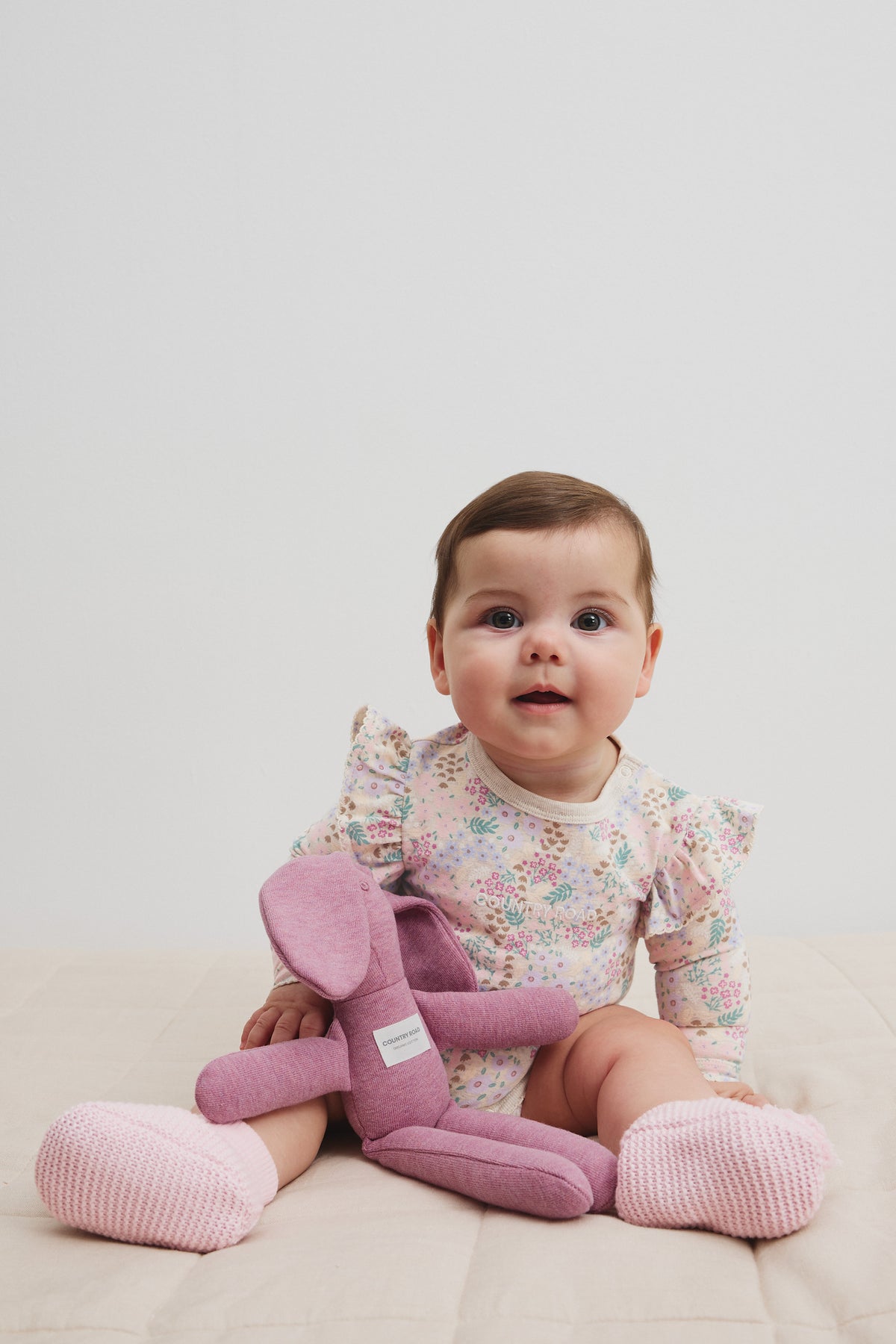 Organically Grown Cotton Blend Frill Long Sleeve Logo Bodysuit